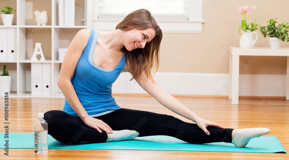 Happy young woman stretching