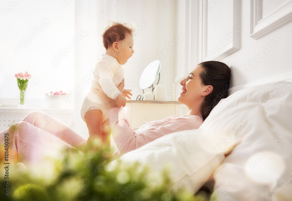 mother playing with her baby