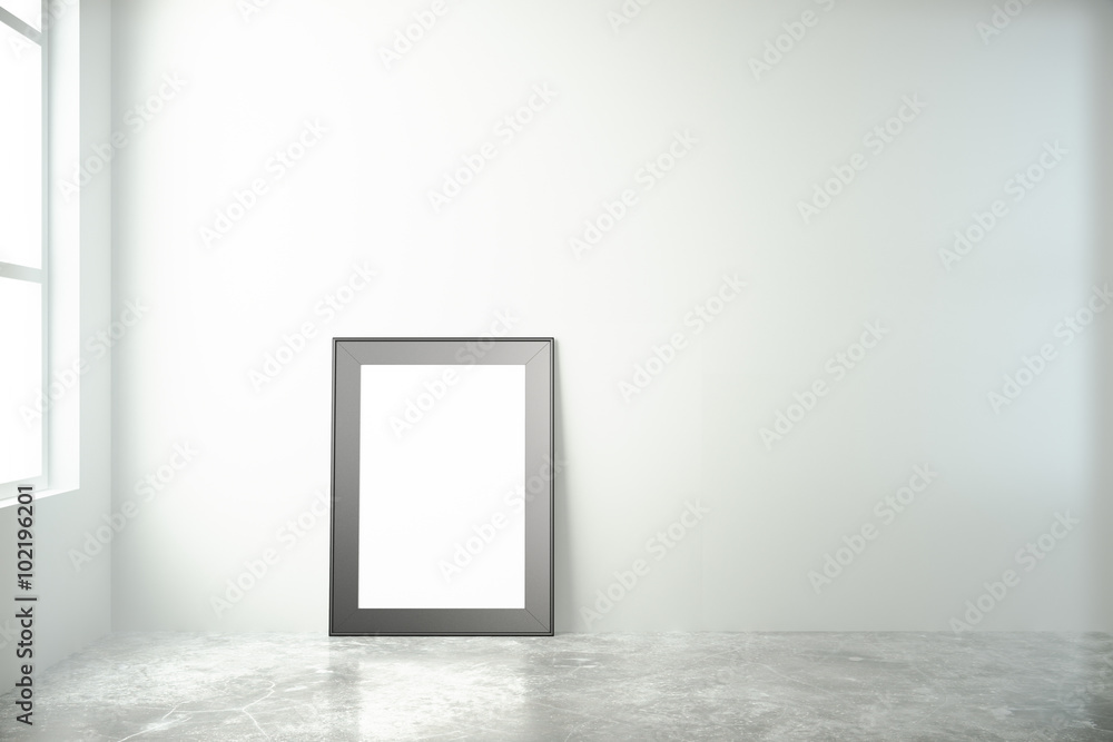 Blank picture frame in a white room with window and concrete flo