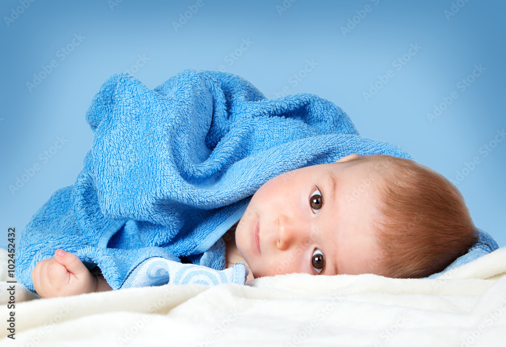 Cute baby in a towel