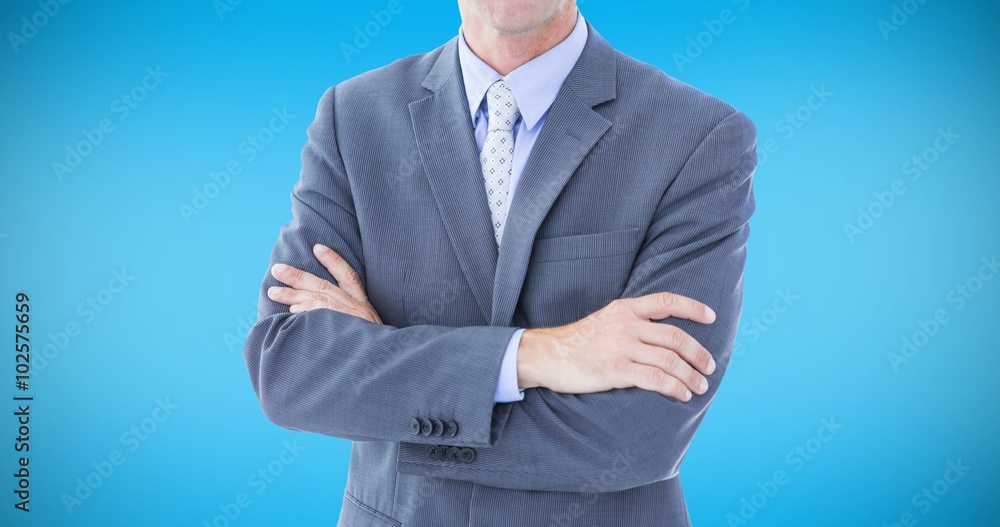 Composite image of portrait of businessman with arm crossed