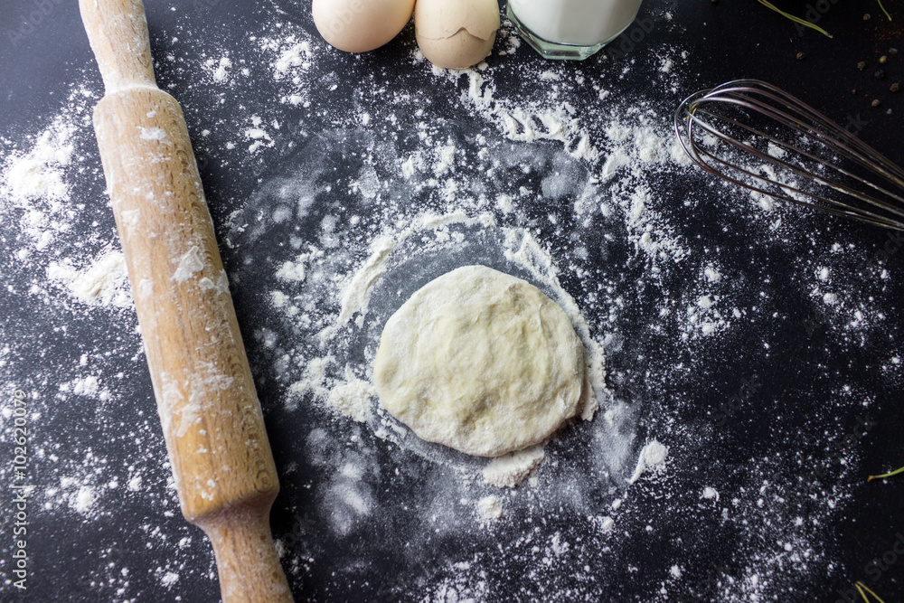 rolling dough with a rolling pin