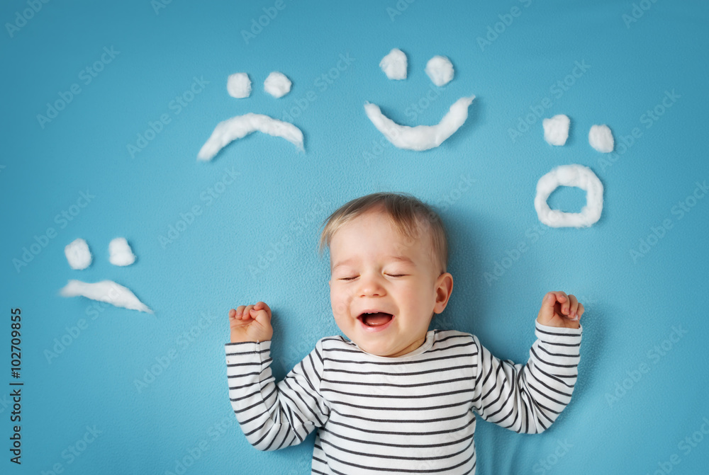 little boy on blue blanket background