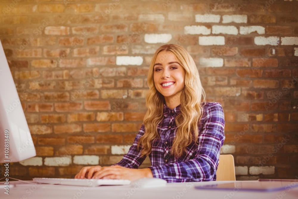 Composite image of pretty casual worker at her desk