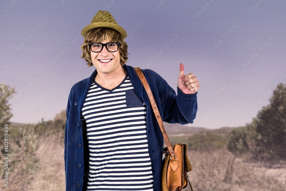 Composite image of smiling hipster making thumbs up