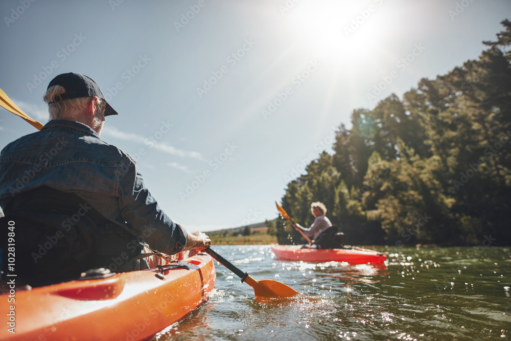 Senior couple canoeing in the lake