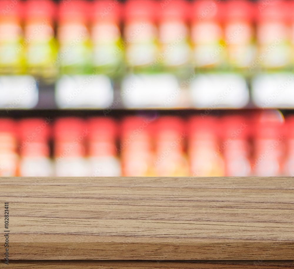 Empty table over blur product shelves background