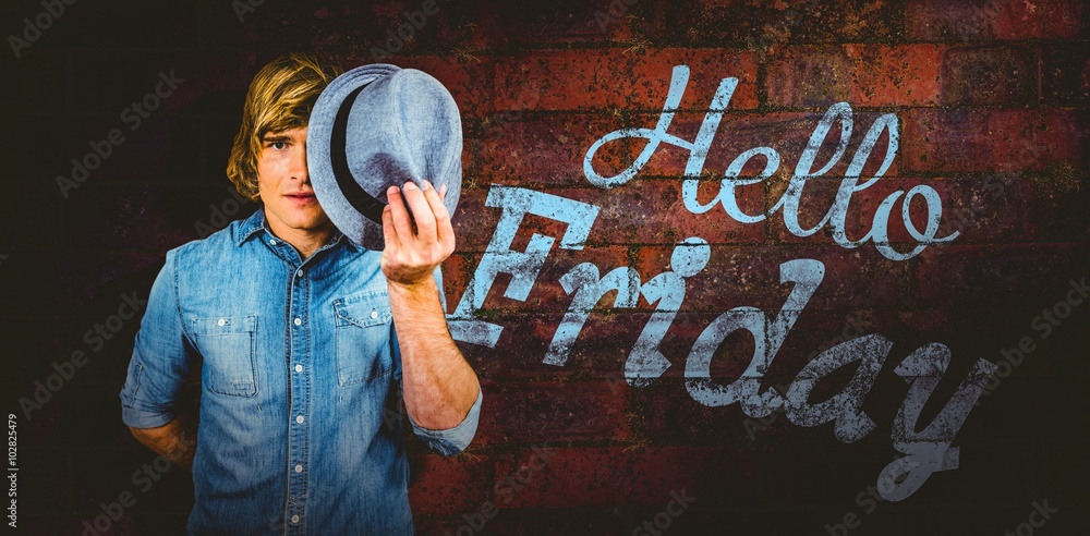 Composite image of focused hipster man hiding his face