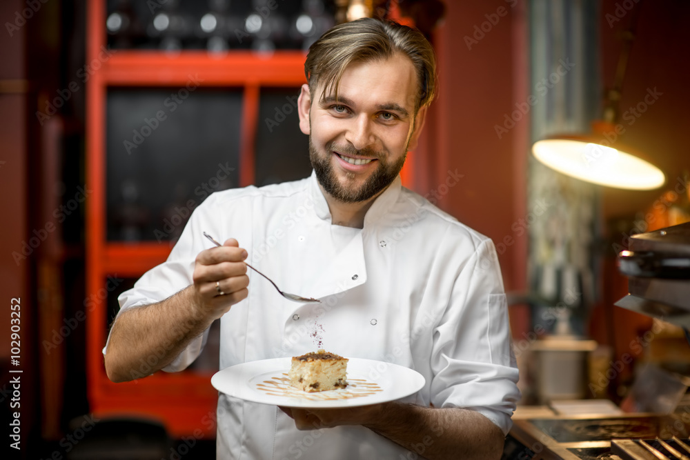 Chef cook decorating cheesecake with chocolate powder