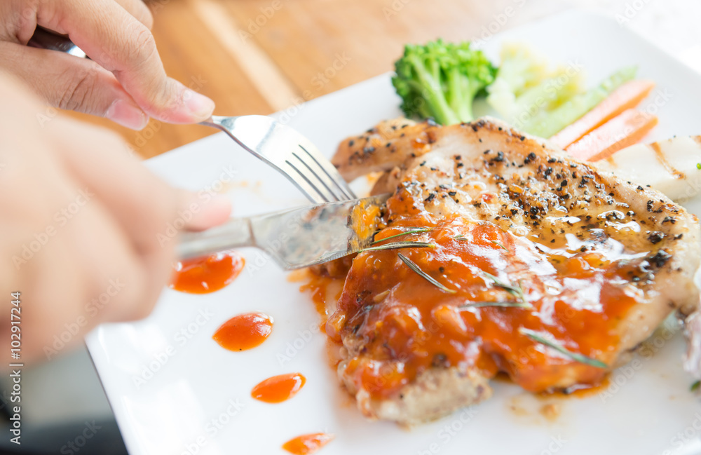 woman eating steak