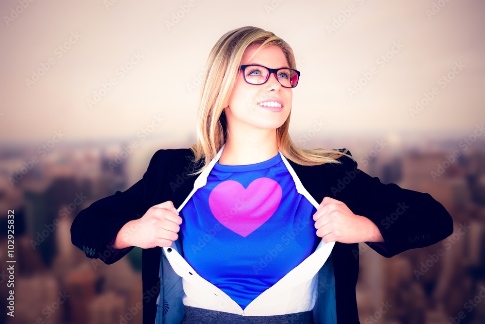 Composite image of businesswoman opening her shirt superhero 