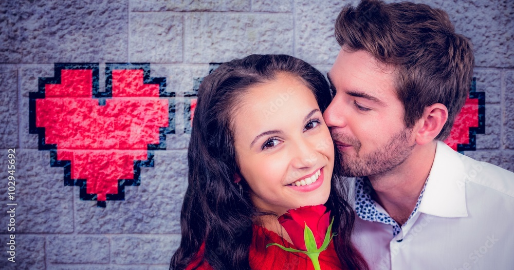 Composite image of smiling couple holding rose