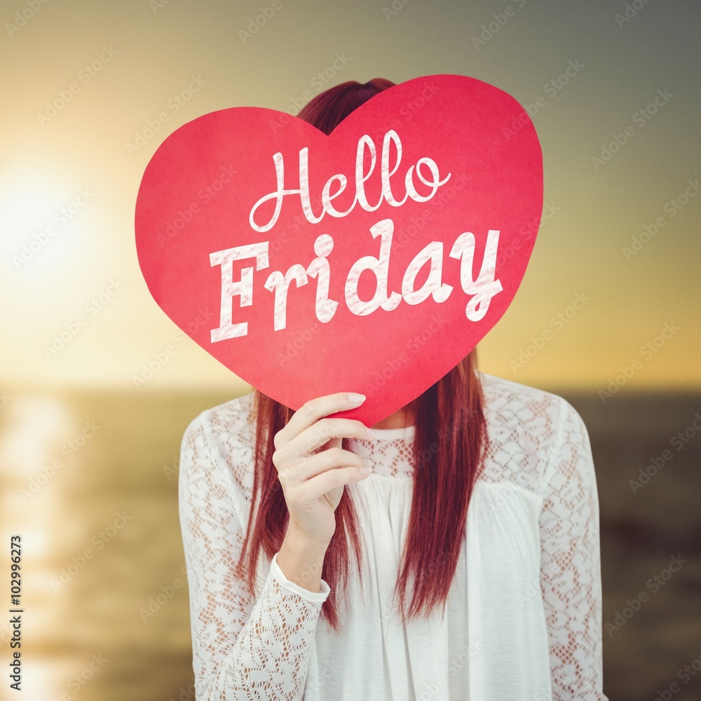 Composite image of smiling hipster woman behind a big red heart