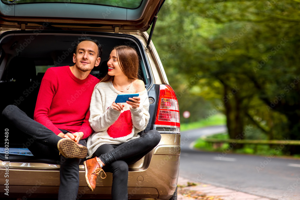 Couple traveling by car