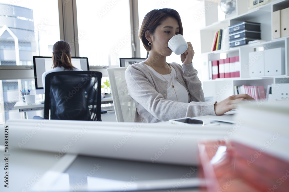 Women have to work with a cup of coffee