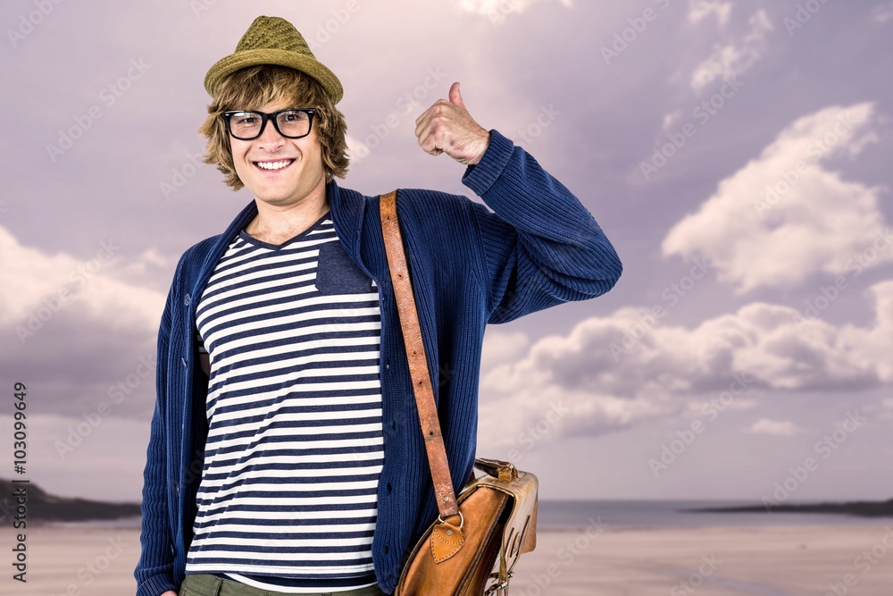 Composite image of smiling hipster making thumbs up