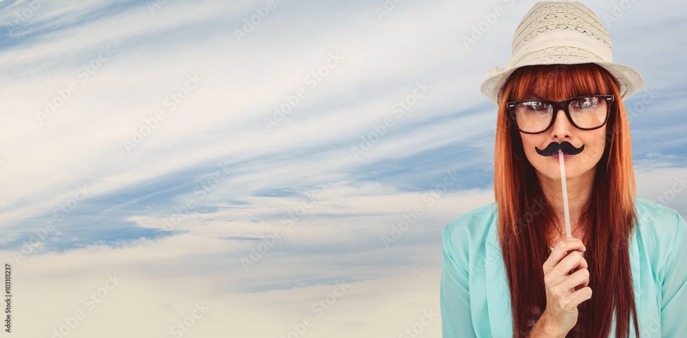 Composite image of happy smiling hipster with a mustache