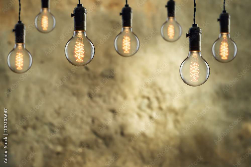 Idea and teamwork concept Vintage  bulbs on wall background