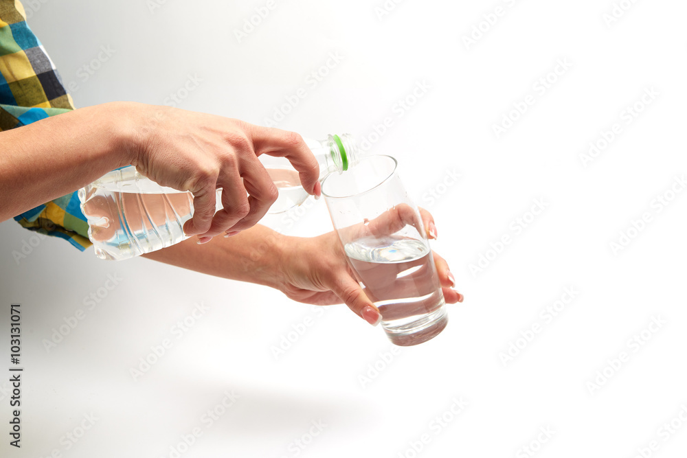 healthy eating, drinks, diet, detox and people concept -  woman with  water in glass  and bottle