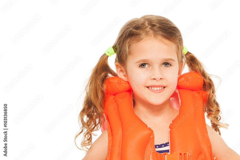 Portrait of smiling little girl in lifejacket