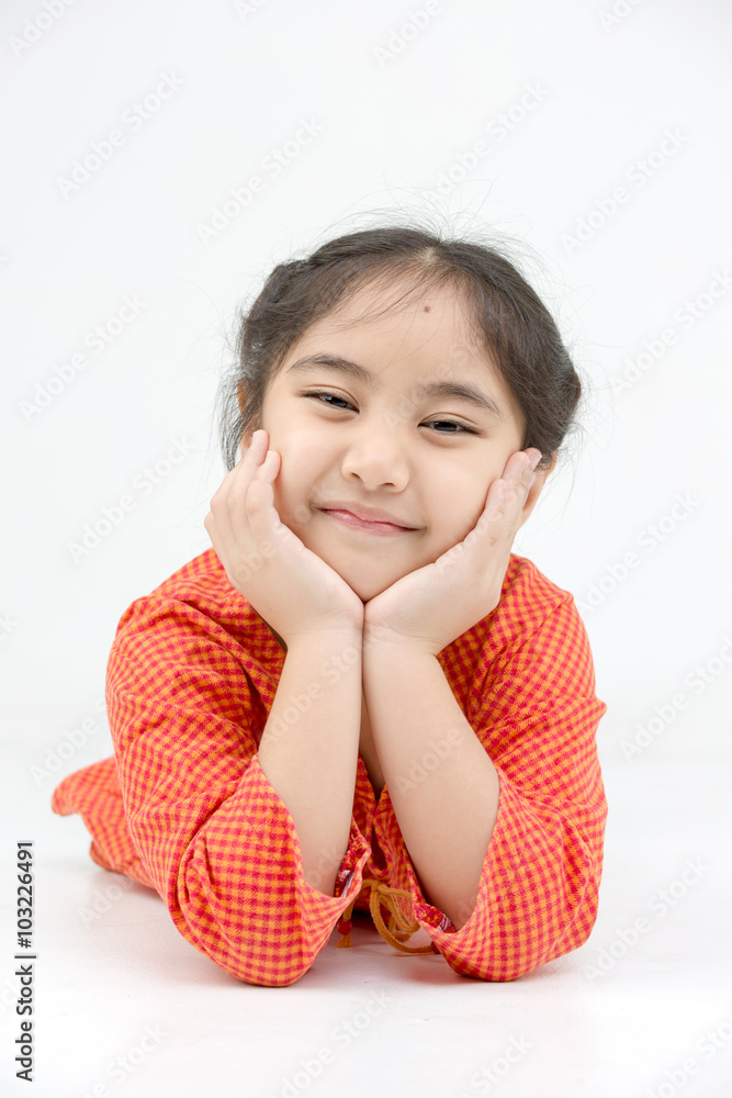 Little Asian girl lying on the floor on isolated