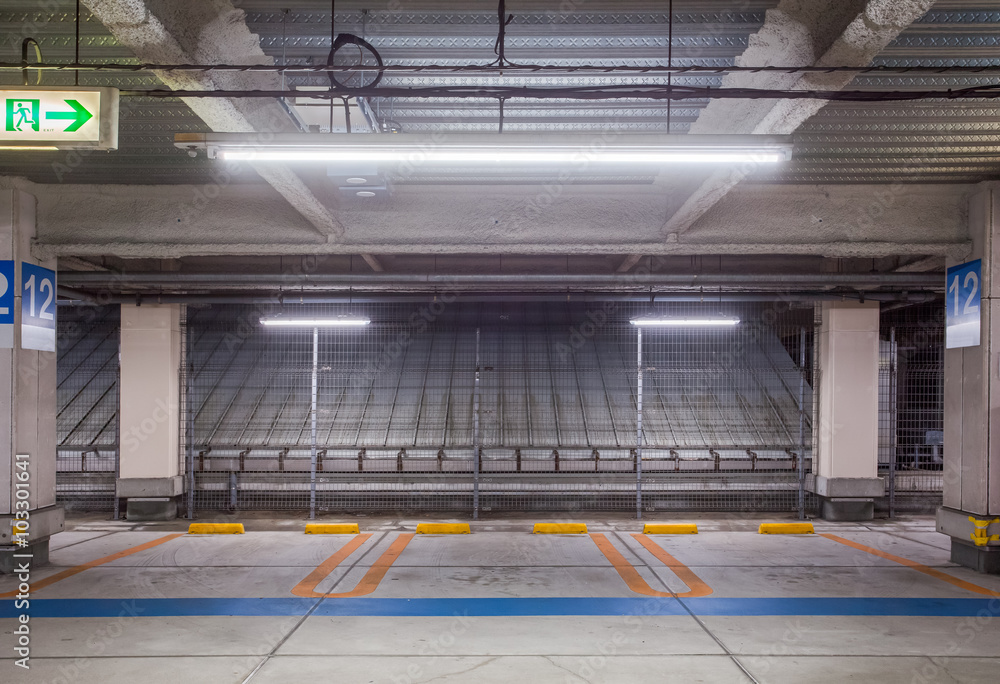 Empty space car park interior at night