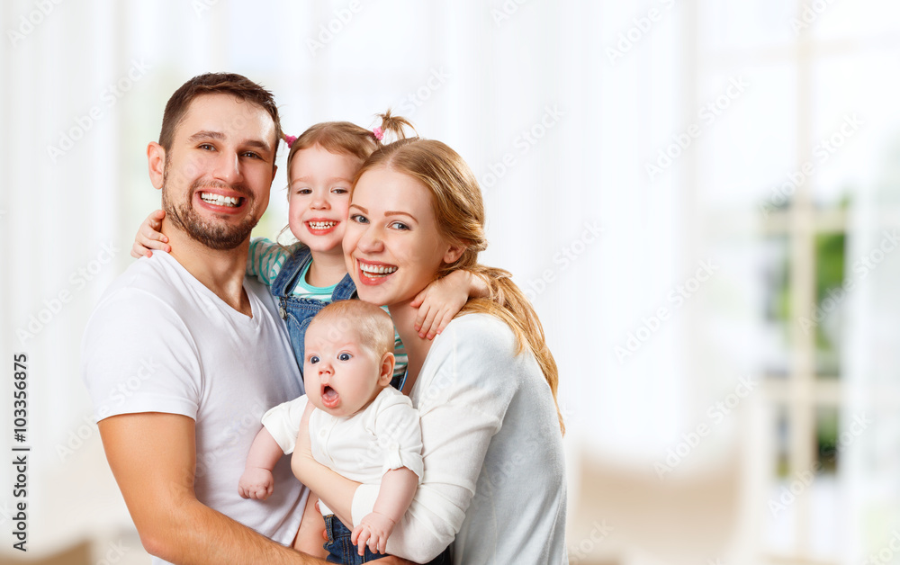 happy family mother, father and children at home