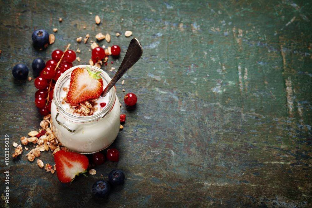 Healthy breakfast of muesli, berries with yogurt and seeds