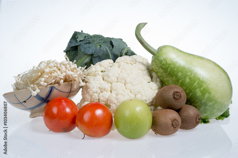 cauliflower,kiwi,tomatoes,jujubes,broccoli,golden needle mushroom and bottle gourd isolated on white