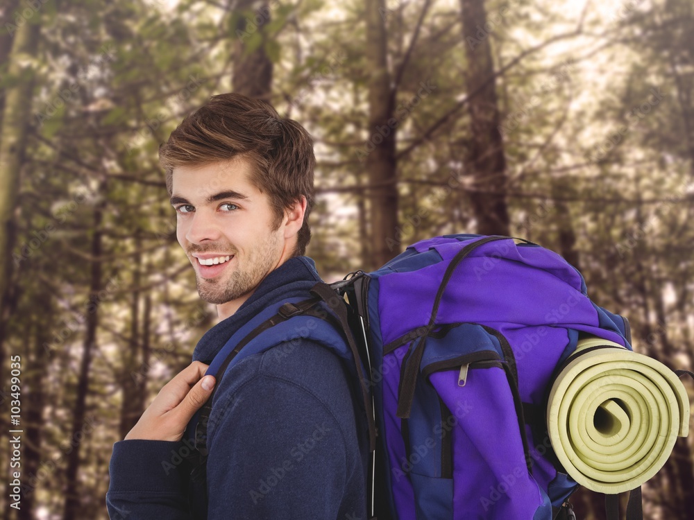 Composite image of side view of happy man with backpack