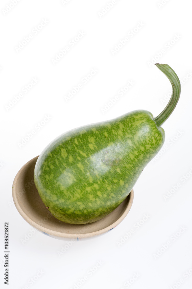 bottle gourd on a bowl