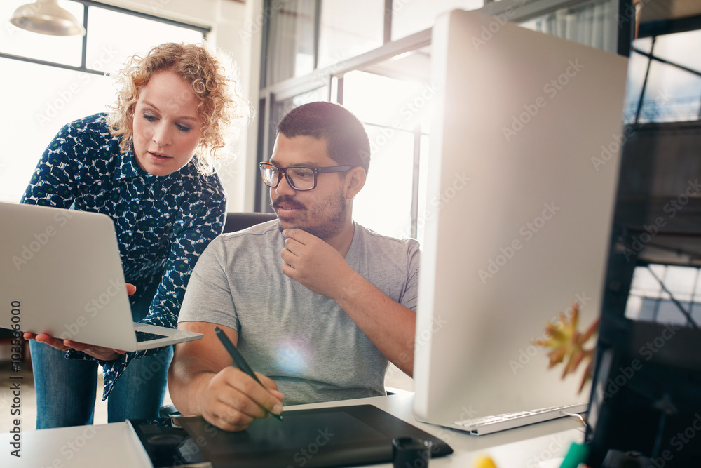 Two designers working in their office