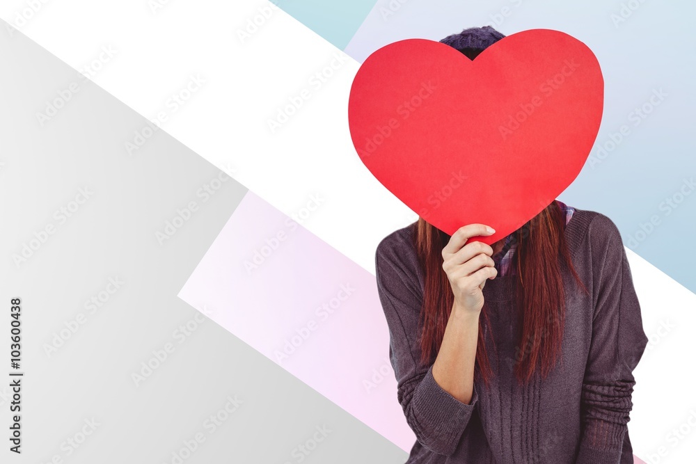 Composite image of hipster woman behind a red heart