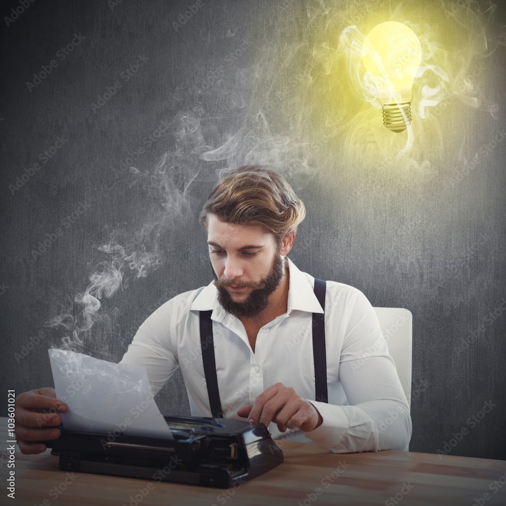 Composite image of hipster using typewriter at desk in office