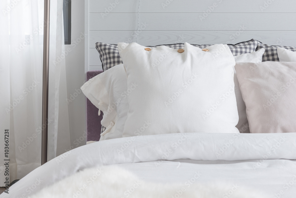 white pillow on bed in modern bedroom