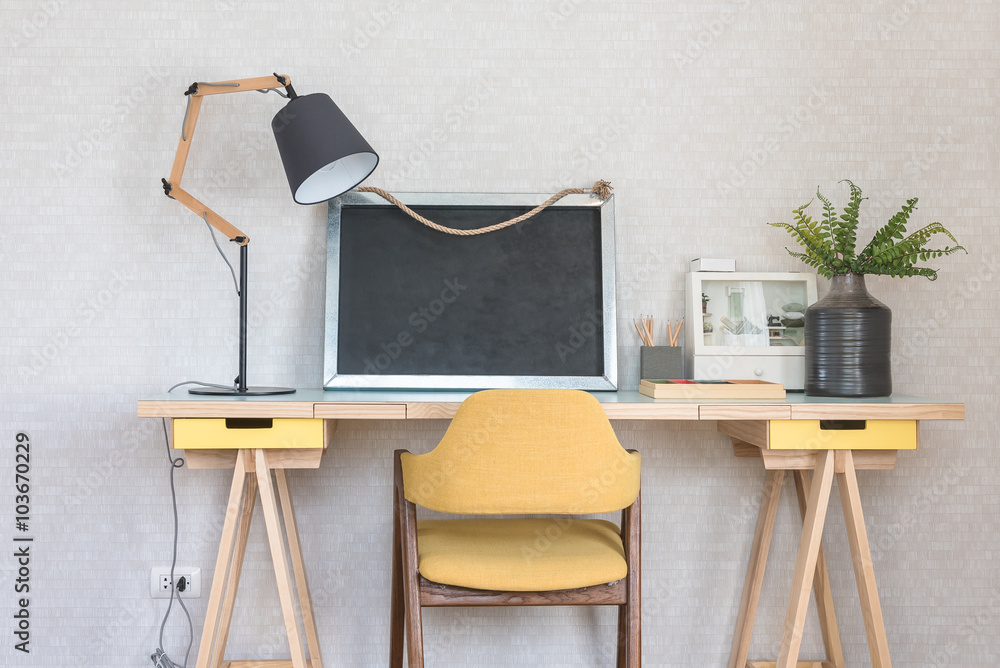 wooden working table with yellow chair in kids room