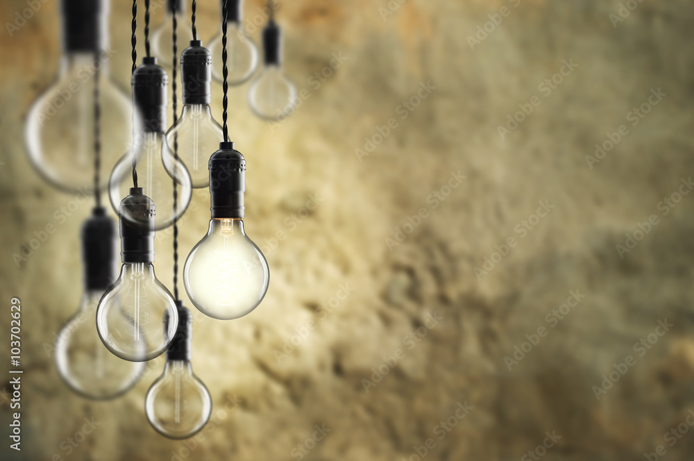 Idea and teamwork concept Vintage  bulbs on wall background