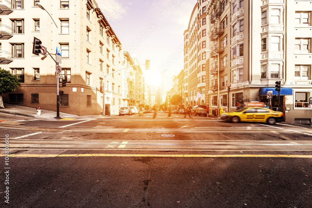 traffic on road and building with sunbeam