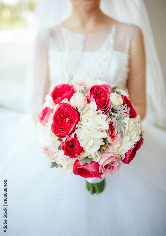 Bride holding bouguet of flowers