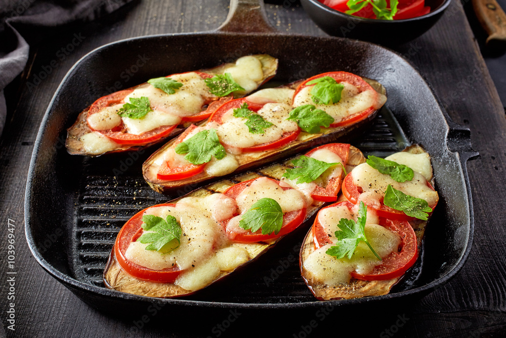 Baked eggplant with tomatoes and cheese