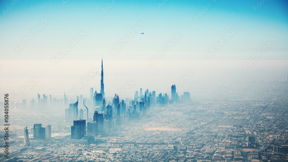 Dubai city in sunrise aerial view