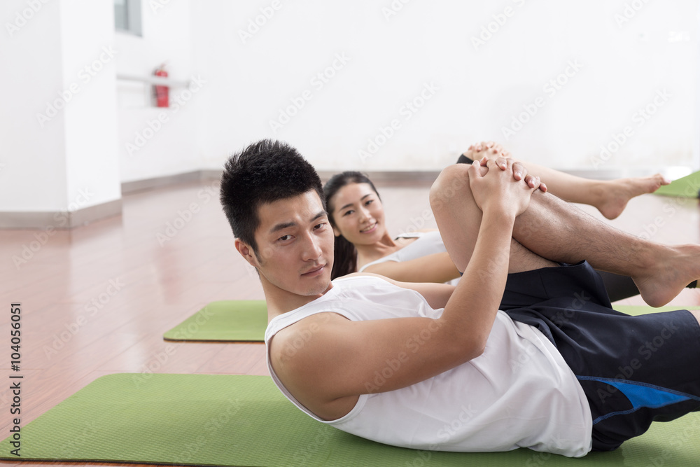 young people working out in modern gym