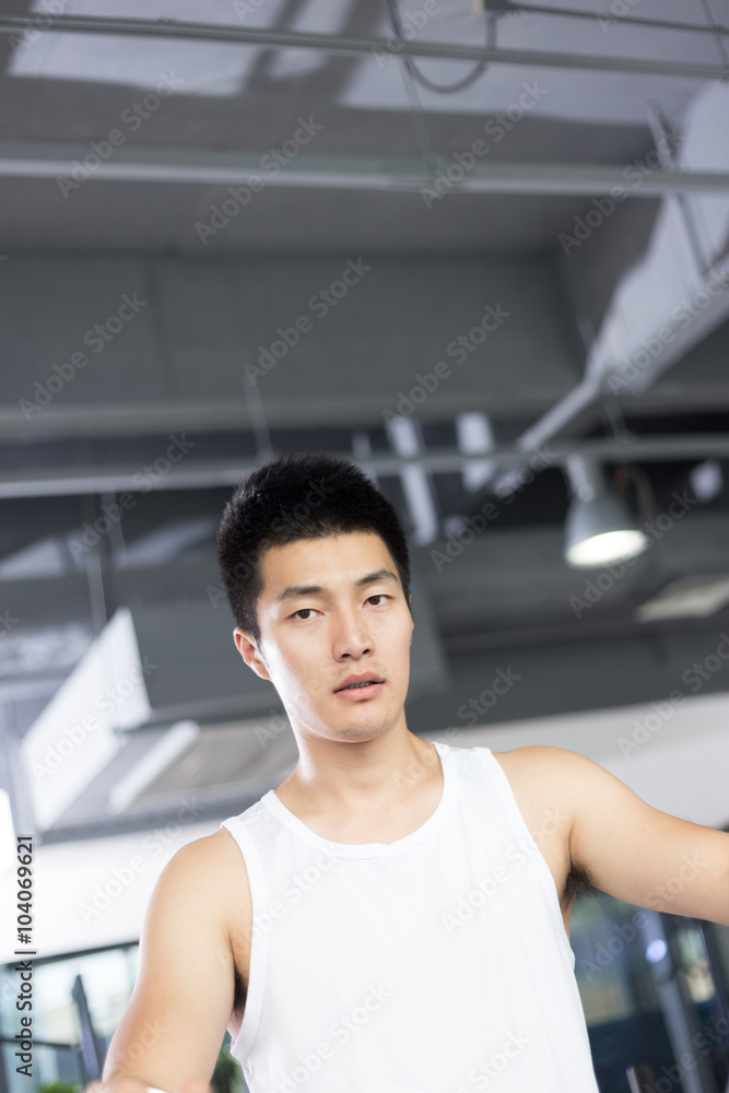 young man working out in modern gym