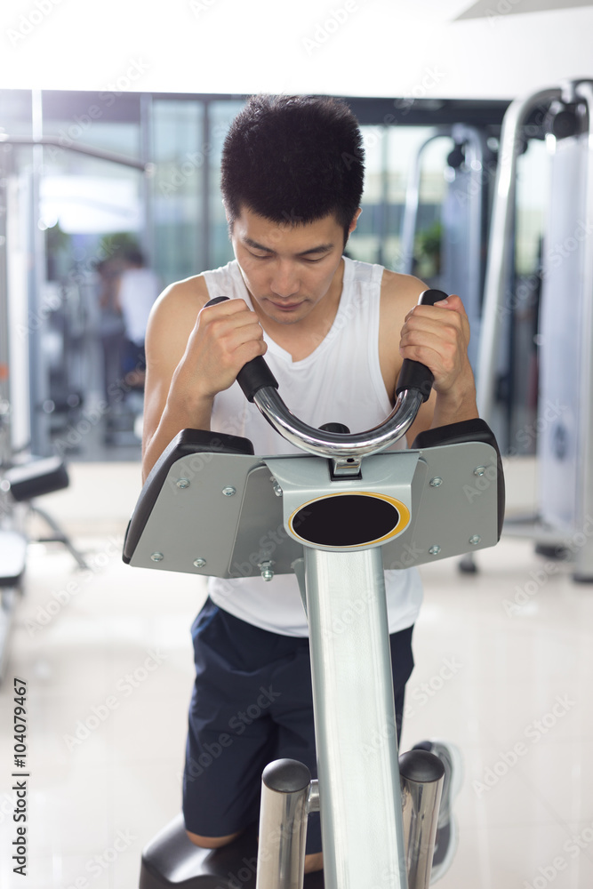 young man working out in modern gym