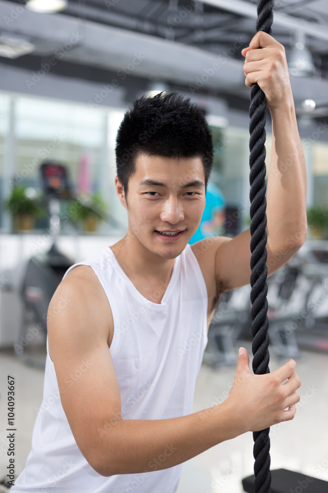 young man working out in modern gym