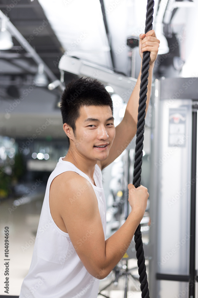 young man working out in modern gym