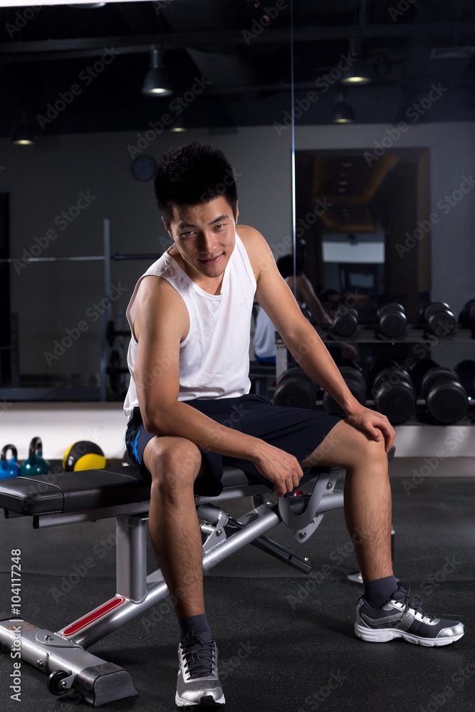 young man working out in modern gym