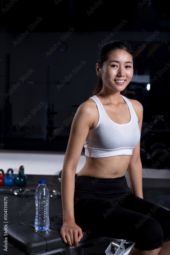 beautiful girl working out in moder gym