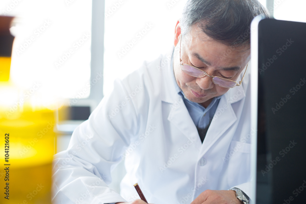 man doing chemical experiment in lab