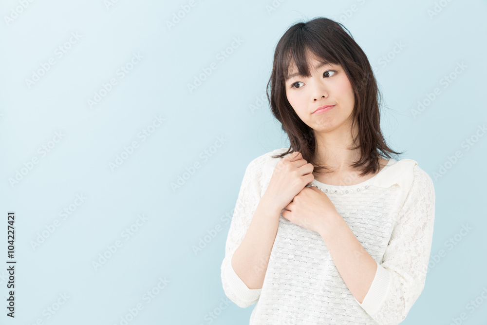 attractive asian woman on blue background